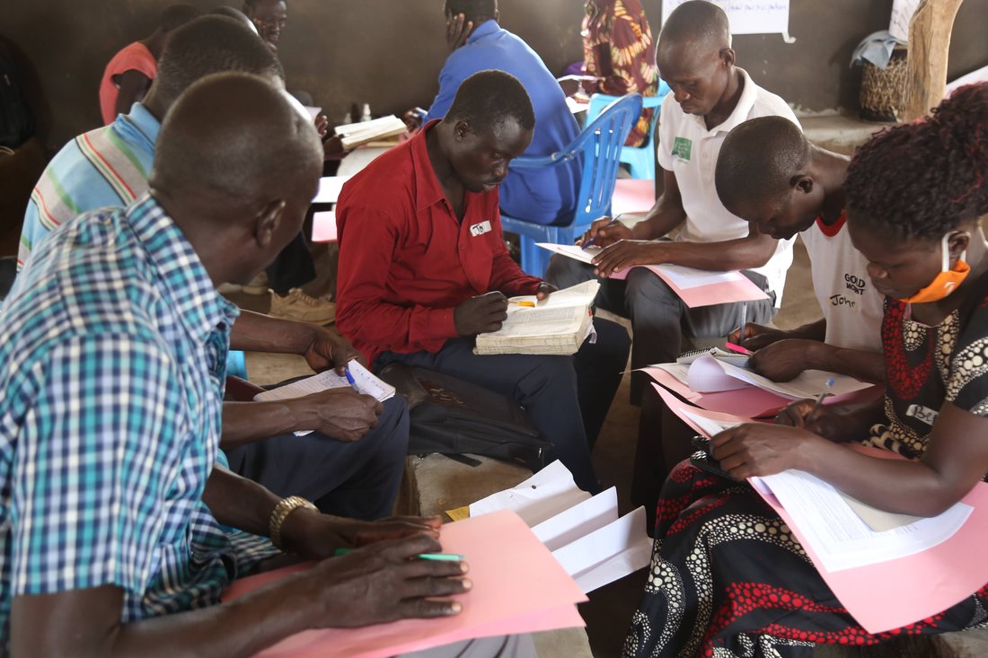 Participants writing during a training