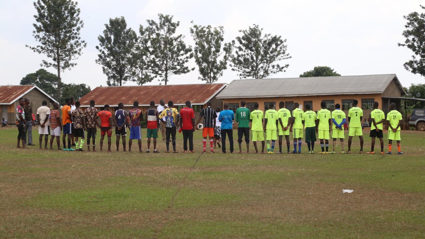 School teams lined up on the football field